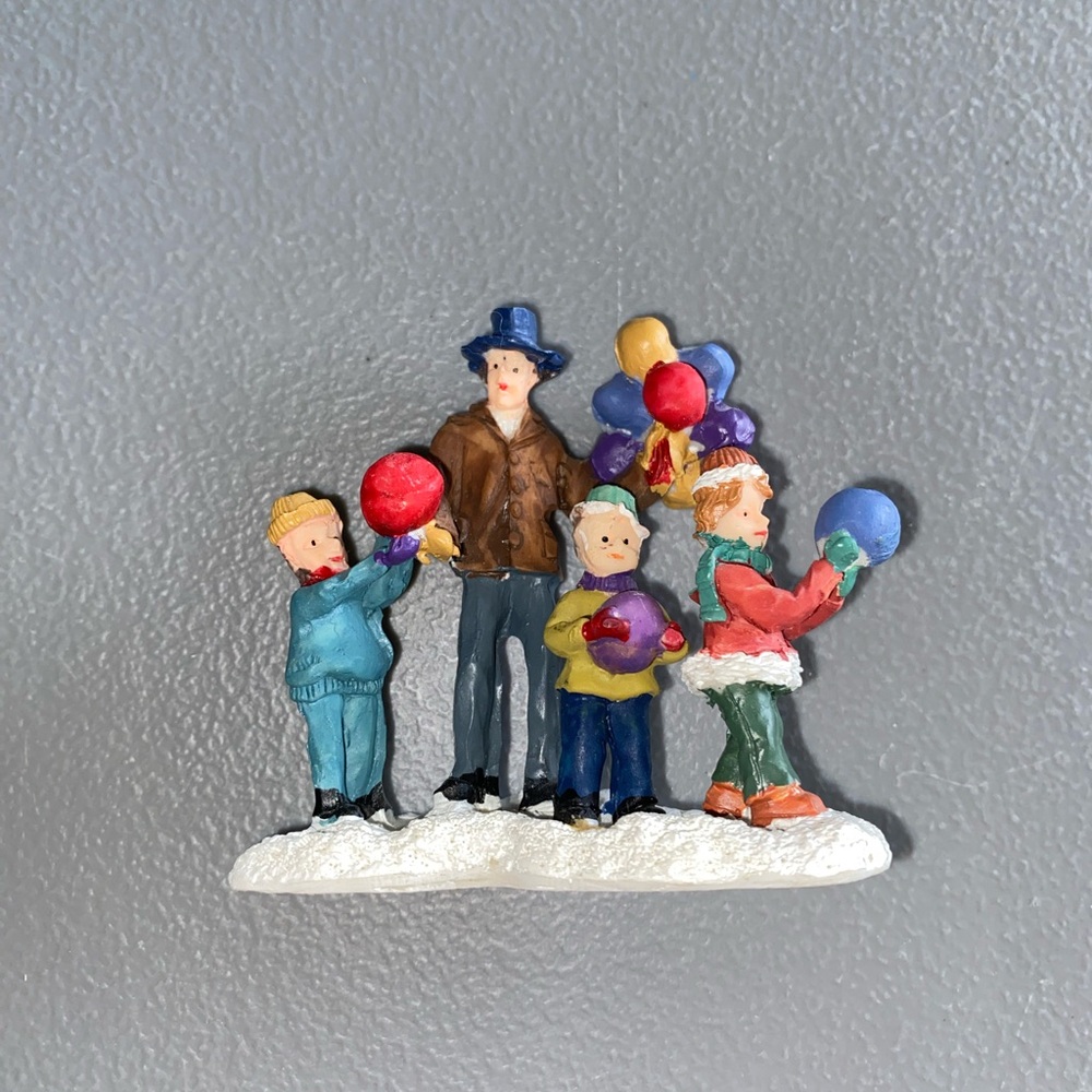 Colorful Family Figurine with Balloons